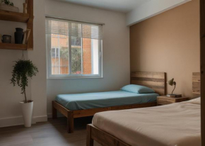 Chambre Deux Palmiers Charme avec Salle de Bain Partagée Proche de l'Aéroport